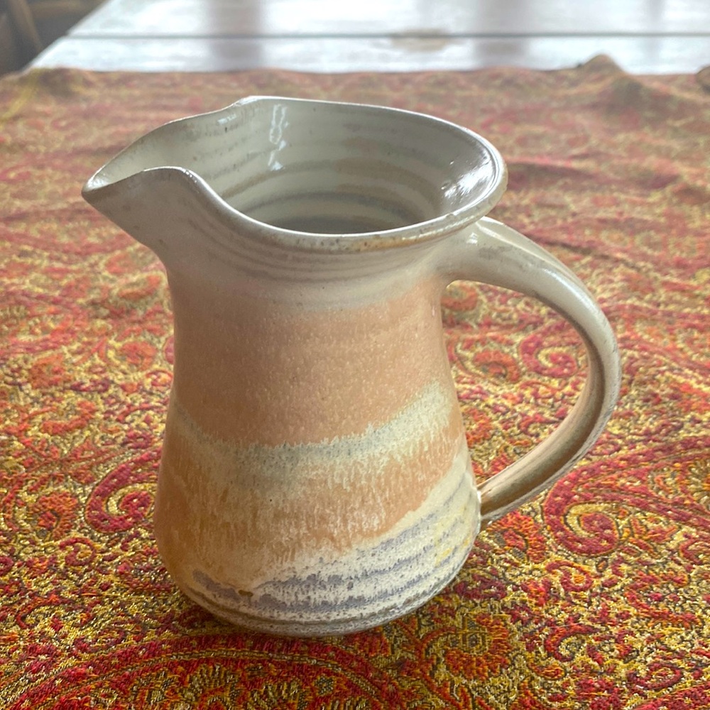 1990’s signed hand thrown pottery handled pitcher with peach, taupe & gray tones